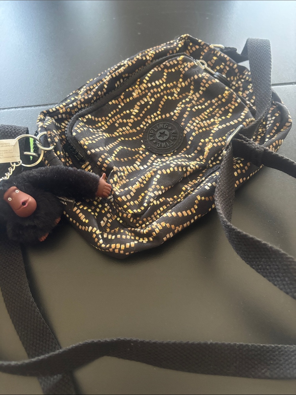 Kipling Black Crossbody Bag with Gold Dot Pattern